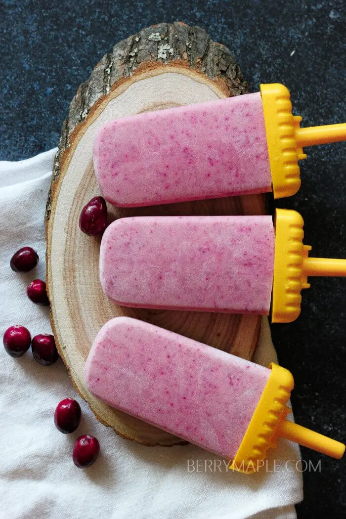 Eggnog cranberry popsicles recipe www.berrymaple.com #popsicle#cranberry#eggnog#holidays#winterpopsicles