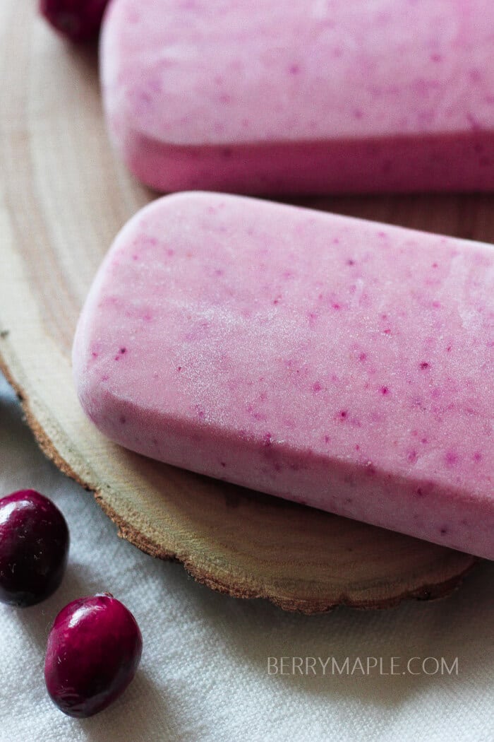 Eggnog cranberry popsicles recipe www.berrymaple.com #popsicle#cranberry#eggnog#holidays#winterpopsicles