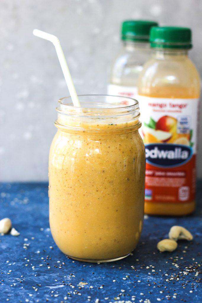 mason jar with smoothie and straw