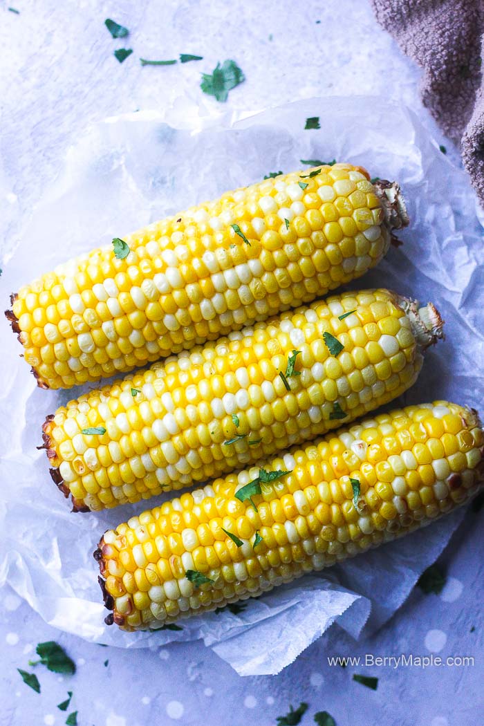 corn on a cob with greens