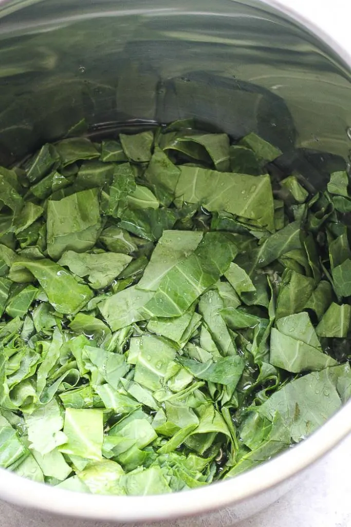 a pot full of chopped collard greens