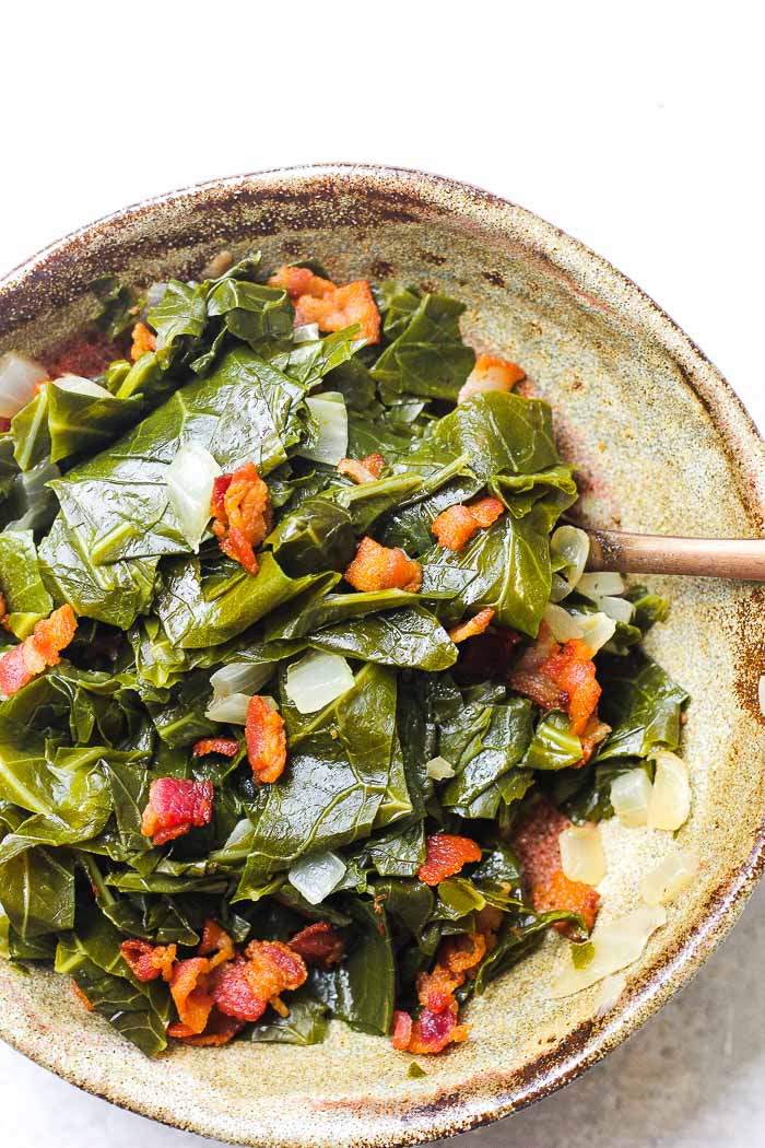 a bowl of southern style collard greens with bacon 