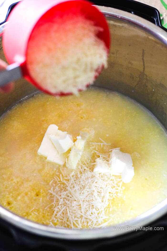 adding parmesan cheese to polenta