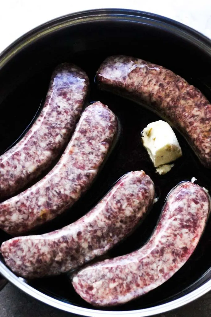 brats with butter in the pan