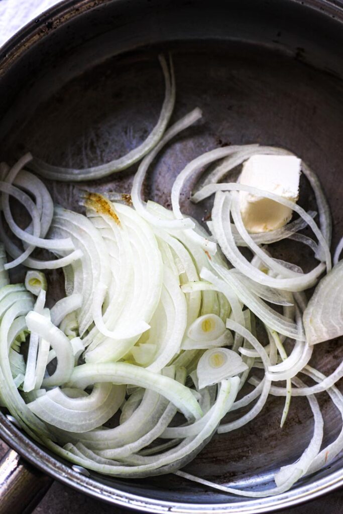 raw onions in the pan with butter