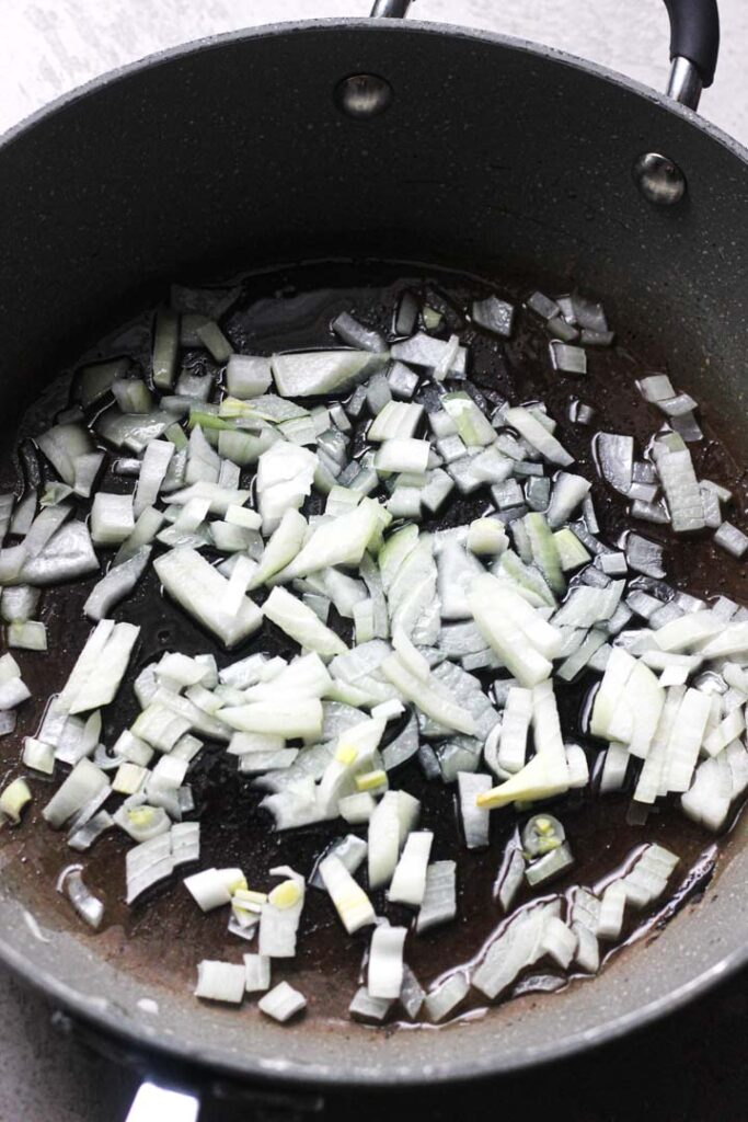 sauteing onions in the pan