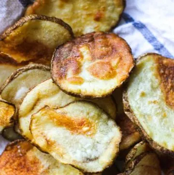 top view of unpeeled potato chips on the kitchen towel