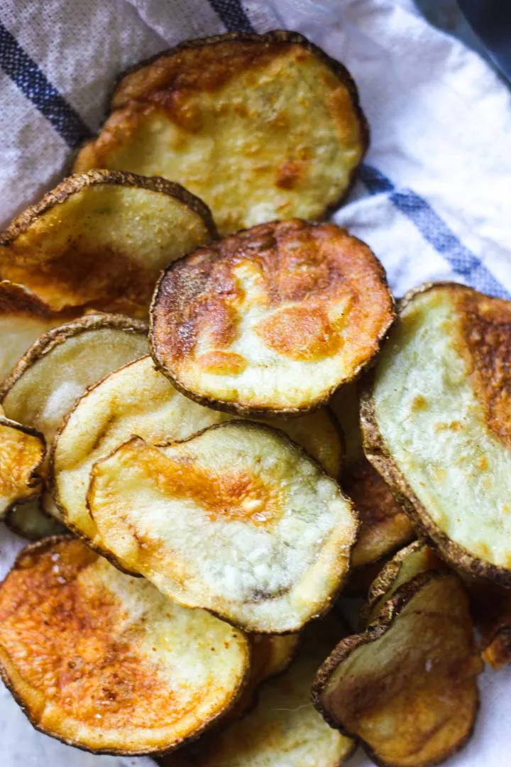 a pile of potato chips on the table