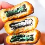 close shot of stack of three fried oreos in dough