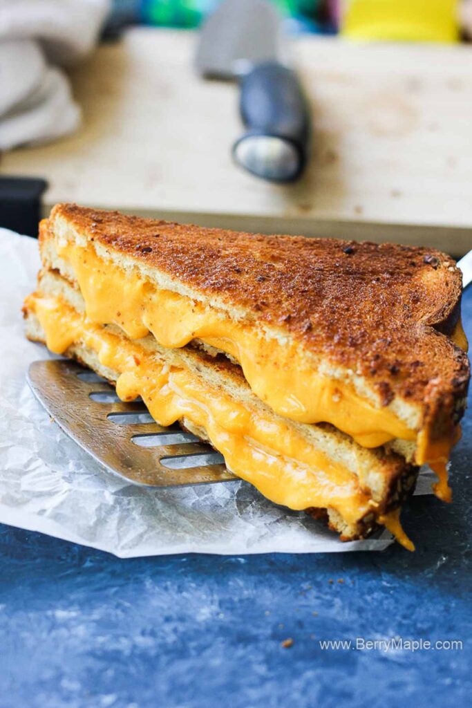 grilled cheese sandwich with melted cheese in the middle