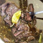 beef pot roast in the broth with pepperoncinis