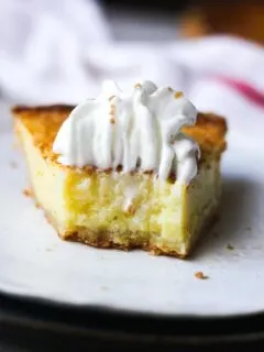 a piece of pie with whipped cream topping