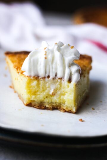 a piece of pie with whipped cream topping
