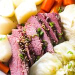 cooked corned beef with carrots, cabbage and potatoes top close view