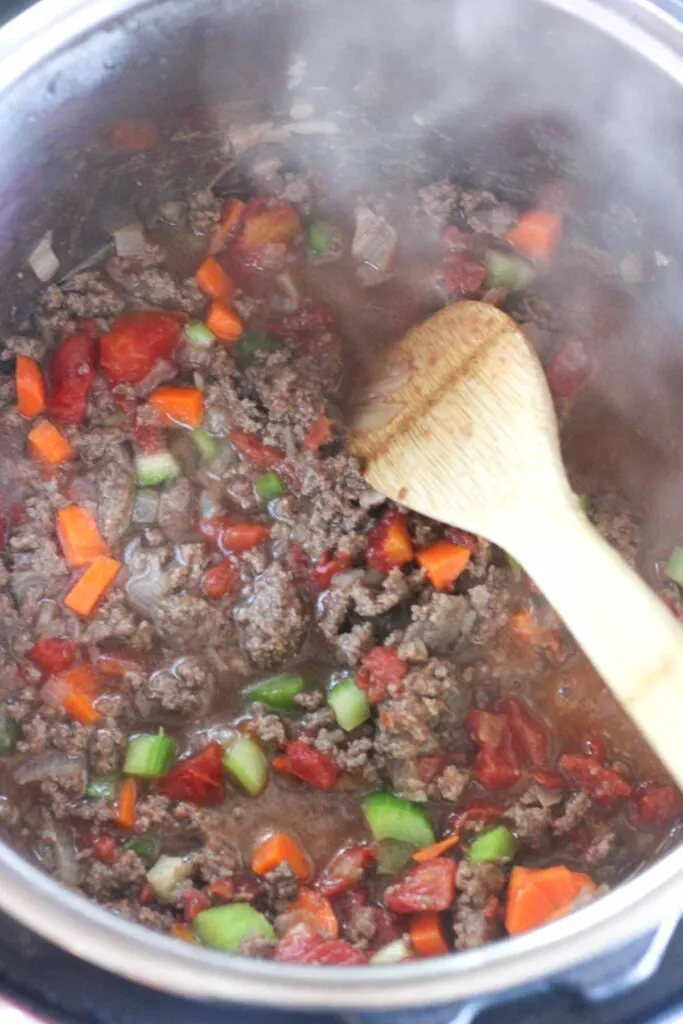 veggies and ground beef in the pressure cooker