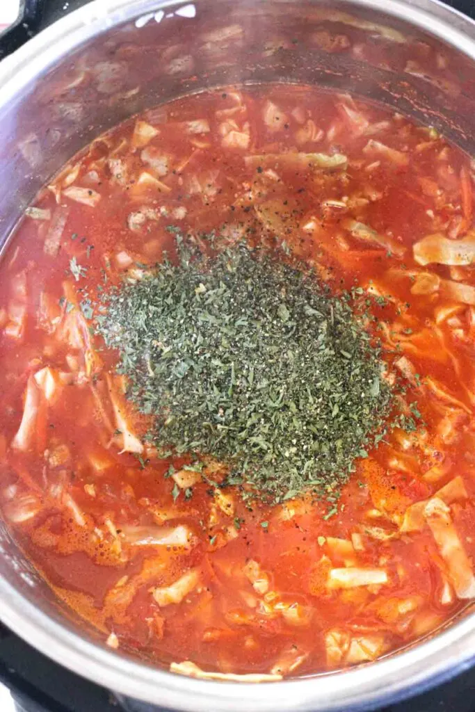 dried parsley in the pot with cabbage soup