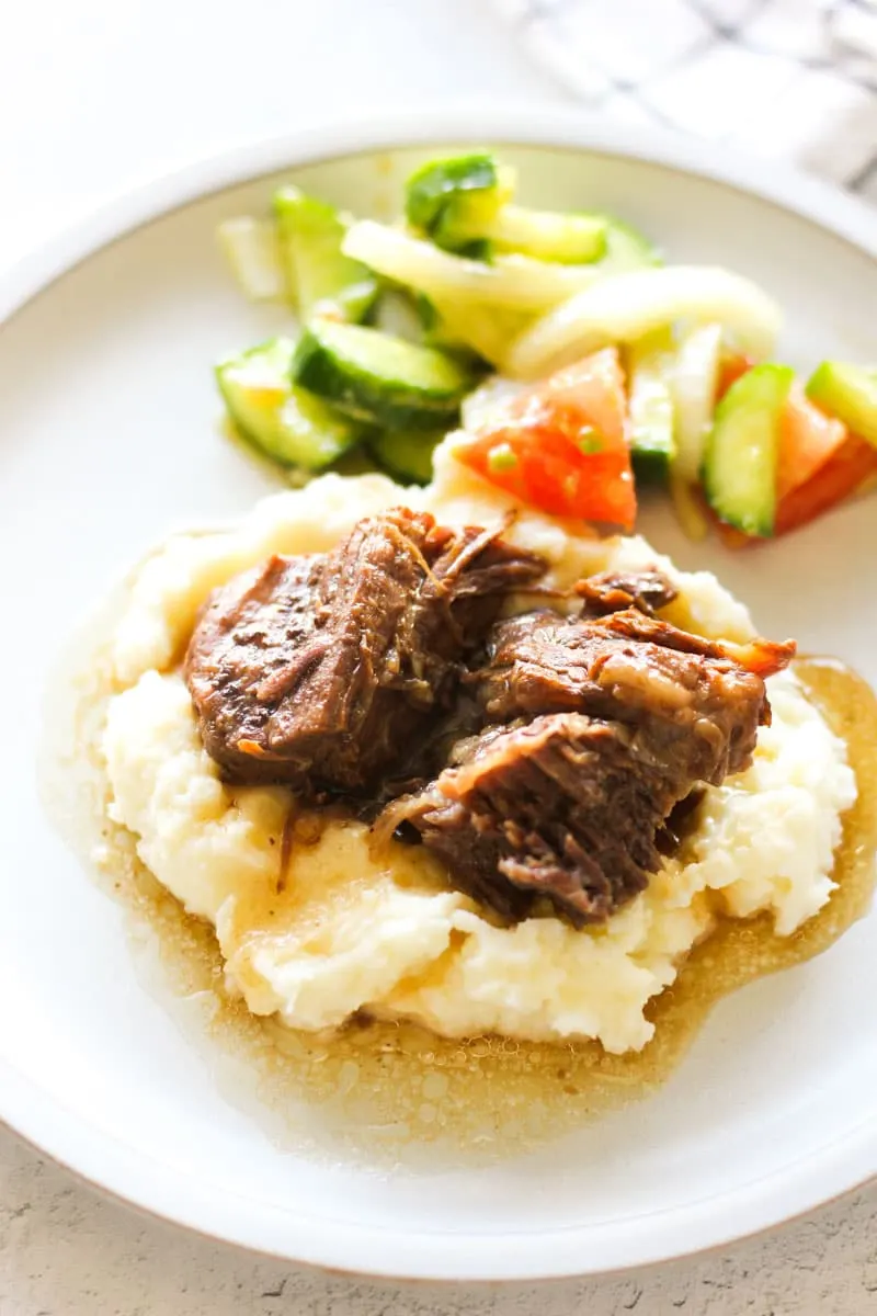georgia pot roaat on the plate with mashed potatoes and gravy