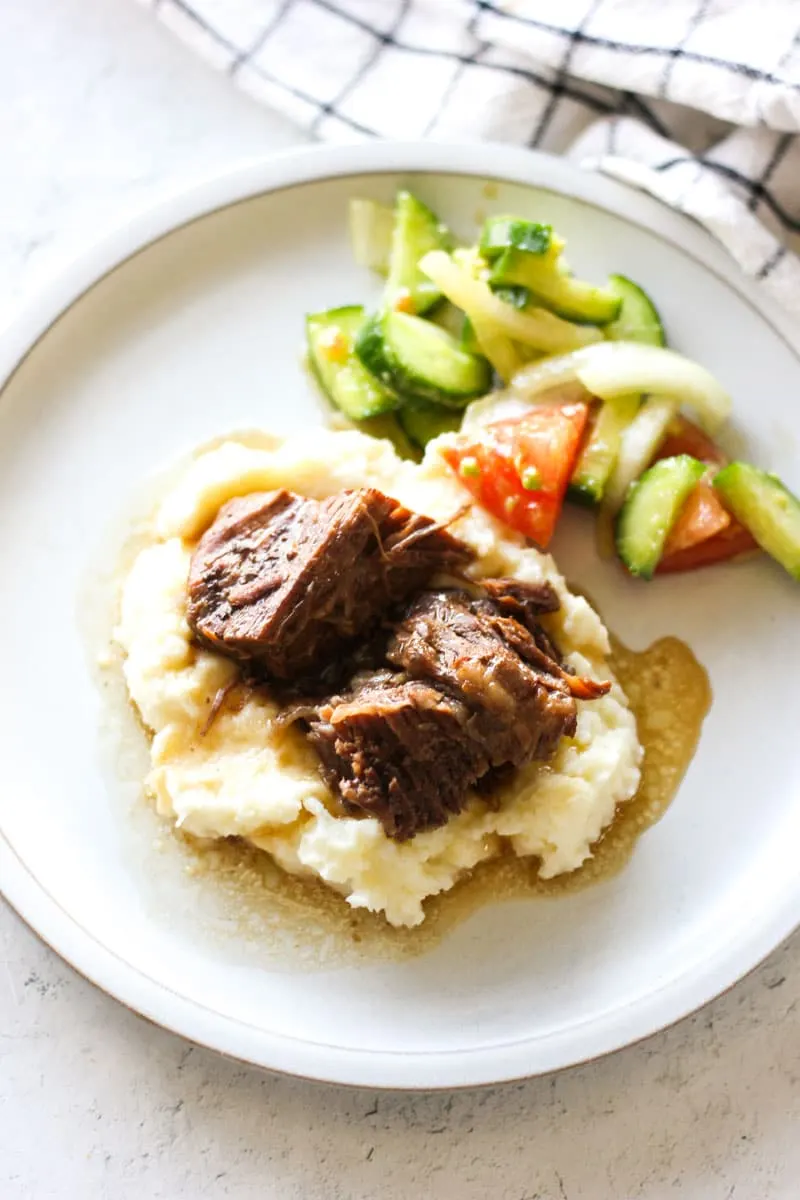 Georgia pot roast on the plate with gravy and mashed potatoes
