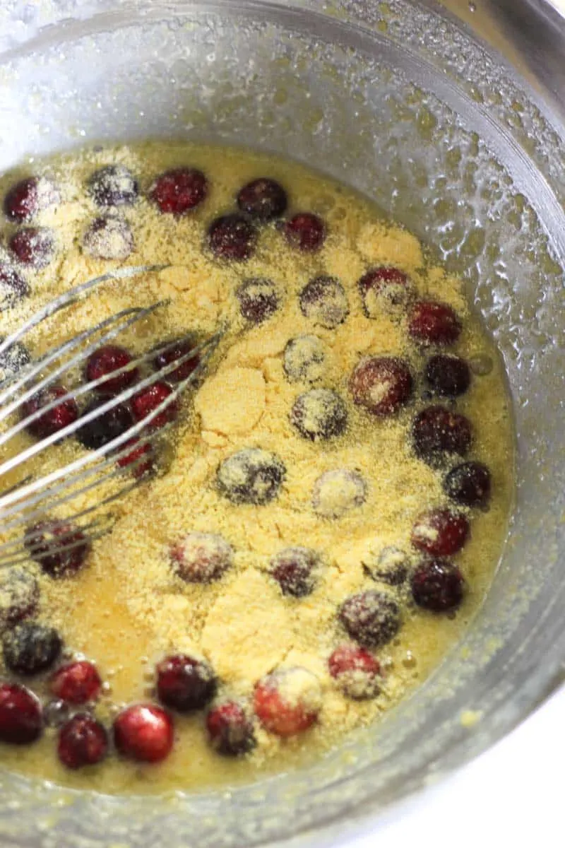 cranberries and cornmeal in the bowl