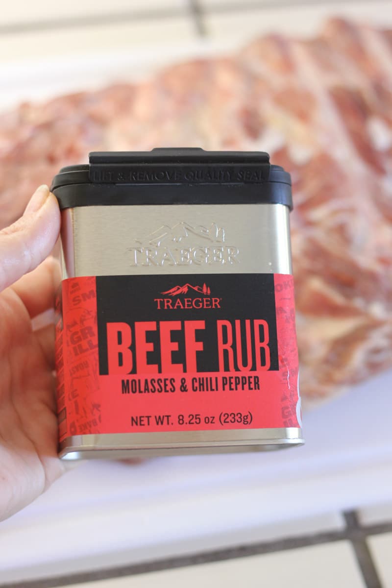 holding a pack of spices